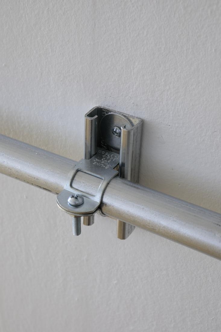 Western Standards K80X4, 2019. Dimension variable. Electrical conduit connected to building's power supply, 4 LED lamps, existing architecture