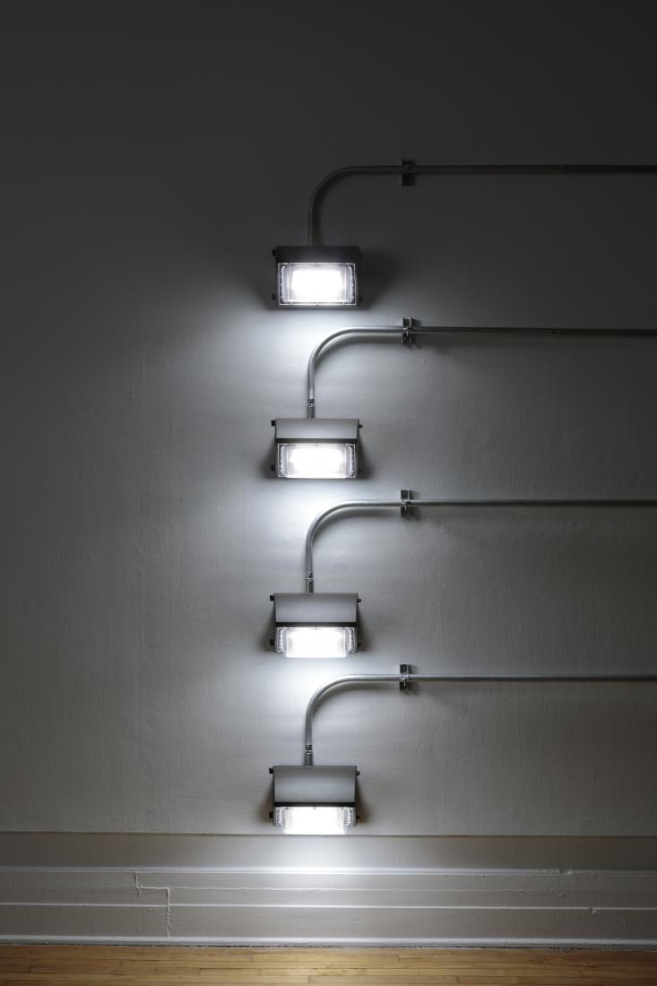 Western Standards K80X4, 2019. Dimension variable. Electrical conduit connected to building's power supply, 4 LED lamps, existing architecture