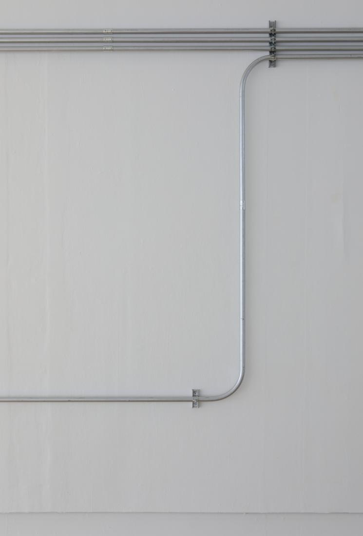 Western Standards K80X4, 2019. Dimension variable. Electrical conduit connected to building's power supply, 4 LED lamps, existing architecture