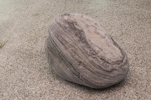 Alina Tenser, Whiff of Black Ice, pumice boulder.